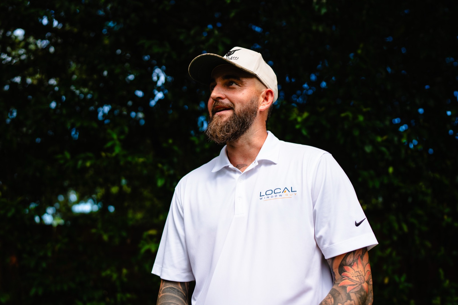 Local Window Guy owner in a branded polo and Built By Deel Construction cap