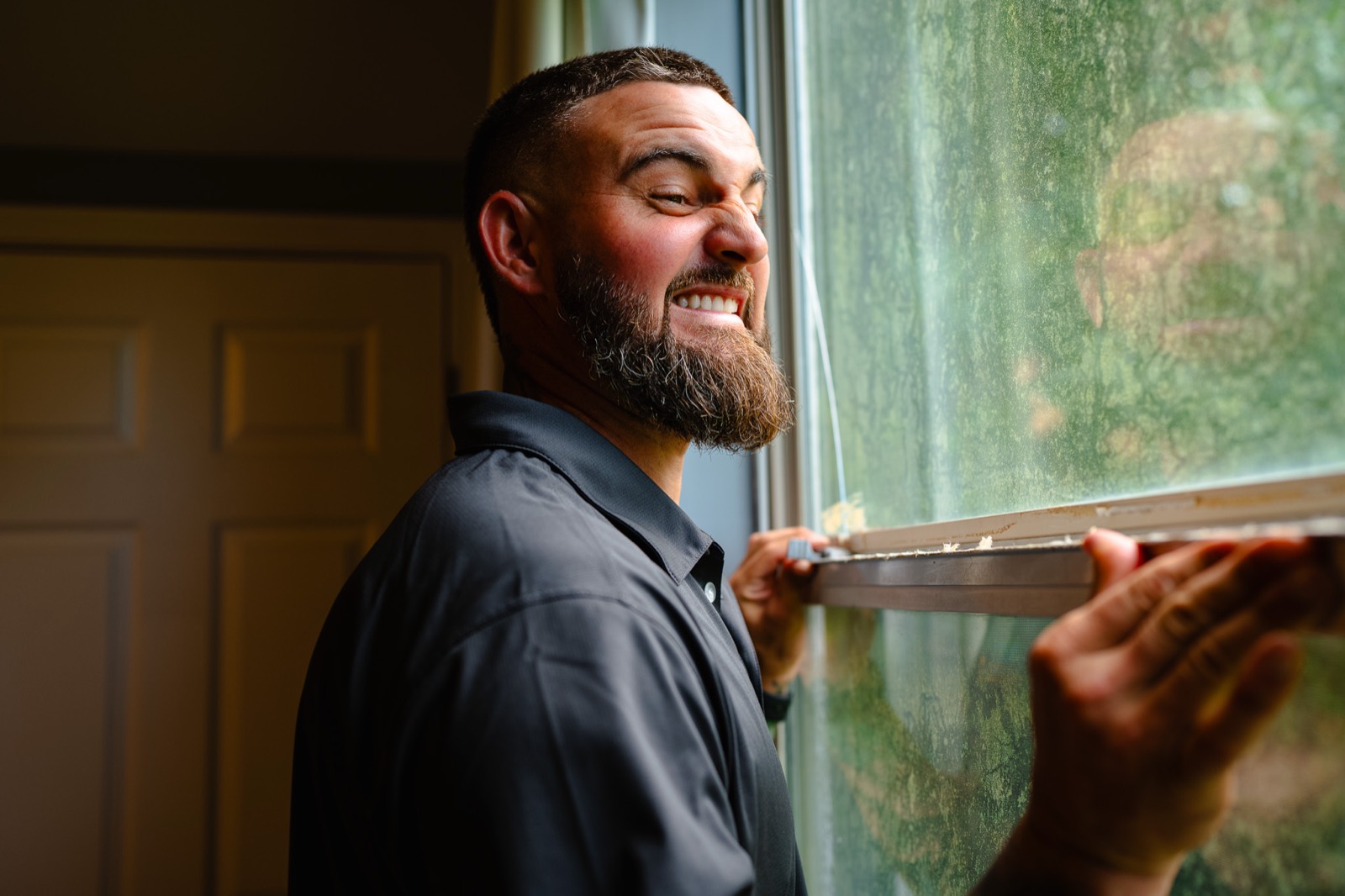 Local Window Guy owner removing a single hung window sash during a replacement